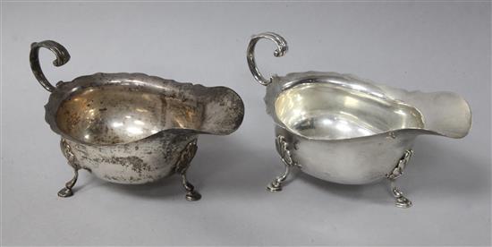 A pair of George V silver sauceboats on three hoof feet, 9.5 oz.